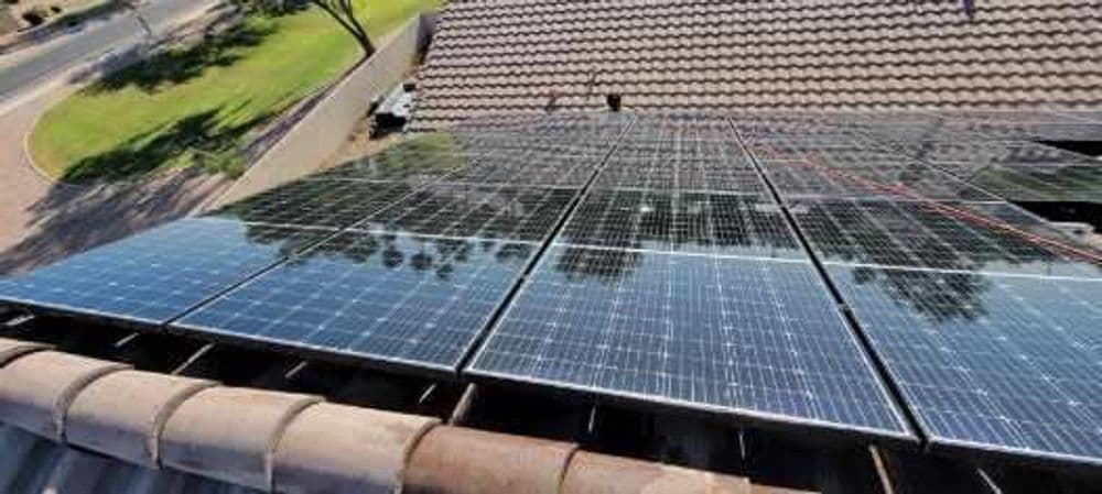Solar panels installed on a residential roof, capturing sunlight for energy conversion.